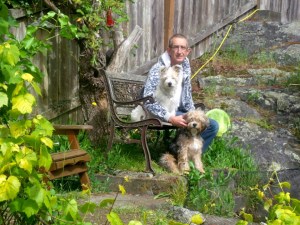 E relaxing by the pond with Coco and Rusty.
