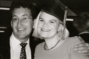 A and E grinning from ear to ear at her high school graduation.